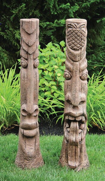 Large exotic tiki set of posts with one sculpture with its tongue